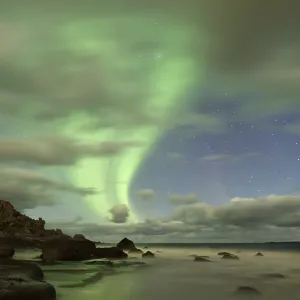 Northern Lights, Aurora Borealis above the beach of Utakleiv