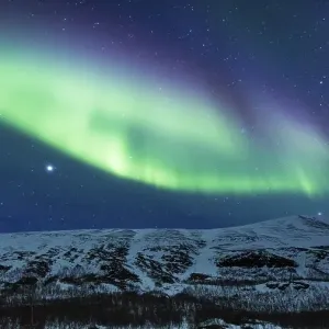 Northern Lights (Aurora borealis) over mountains