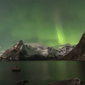 Northern Lights or Aurora Borealis over mountains Northern Lights or Aurora Borealis over mountains