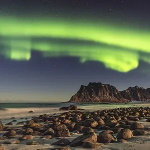 Northern lights (Aurora borealis) in winter Scandinavian landscape Northern lights (Aurora borealis) in winter Scandinavian landscape