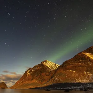 Northern lights (Aurora borealis) in winter Scandinavian landscape Northern lights (Aurora borealis) in winter Scandinavian landscape