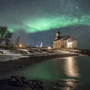 Northern lights over church of Gimsoy