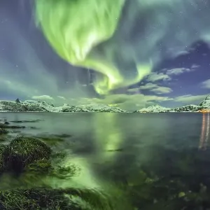 Northern lights at a fjord in Tromso