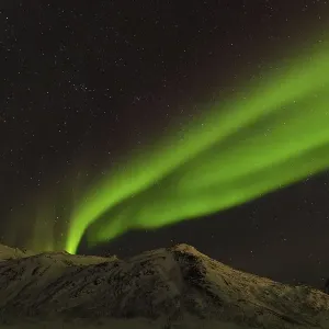 Northern Lights over snow covered mountains