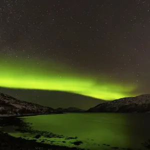 Northern Lights over snow covered mountains