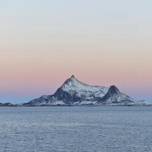 Norwegian coast at the Arctic Circle with Mount Hestmannen in the distance Norwegian coast at the Arctic Circle with Mount Hestmannen in the distance