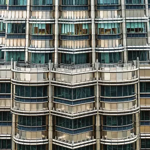 Nov 20, 2019 - Kuala Lumpur, Malaysia: Symmetrical close-up of Petronas Towers facade with metallic surfaces