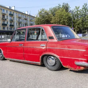 Novgorod, Russia - August 31, 2024: Vintage soviet tuned Lada-2103 lowered suspension vehicle at the city street