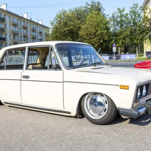 Novgorod, Russia - August 31, 2024: Vintage soviet tuned Lada-2103 lowered suspension vehicle at the city street