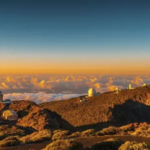 Observatories of Roque de los Muchachos in the Caldera de Taburiente in a beautiful orange sunset Observatories of Roque de los Muchachos in the Caldera de Taburiente in a beautiful orange sunset