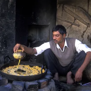 Oil baker preparing sweet pastries Oil baker preparing sweet pastries