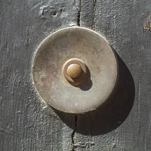 Old bell on a half-timbered house in the old town centre Old bell on a half-timbered house in the old town centre