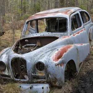 Old car wreck in the car cemetery of Kyrkoe Mosse