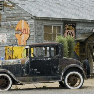 Old Ford vintage car along the Route 66 at the general store of the ghost town Hackberry in Arizona
