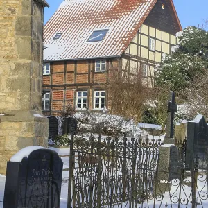 Old half-timbered house, historic cemetery at St