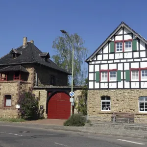 Two old quarrystone and half-timbered houses