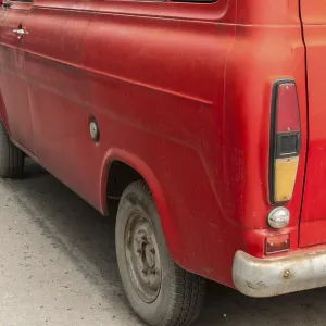 Back side of old red vintage van closeup Back side of old red vintage van closeup