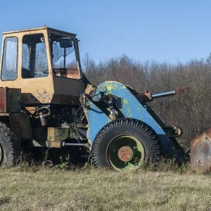 Old vintage bulldozer on countryside meadow in sunny day Old vintage bulldozer on countryside meadow in sunny day