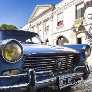 Oldtimer in front of a facade with graffiti Oldtimer in front of a facade with graffiti