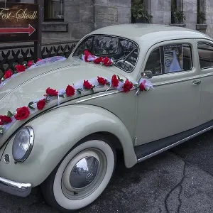 Oldtimer, VW Beetle from 1955 as wedding car decorated with roses