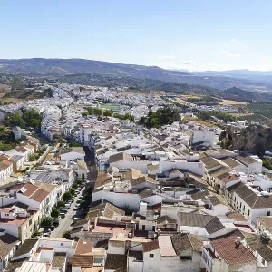 Olvera town, cadiz, spain displaying traditional white houses and surrounding olive groves in olvera Olvera town, cadiz, spain displaying traditional white houses and surrounding olive groves in olvera