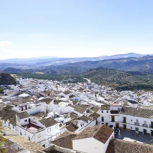 Olvera town displaying traditional white houses under a clear sky in olvera Olvera town displaying traditional white houses under a clear sky in olvera