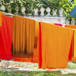 Orange clad robes aka. buddhist monks clothes drying outside
