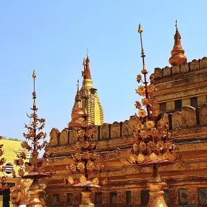Ornamental golden details of Shwezigon Pagoda under a deep blue sky in Nyaung-U Ornamental golden details of Shwezigon Pagoda under a deep blue sky in Nyaung-U