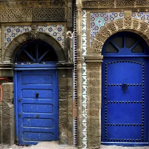 Two ornately decorated blue doors in the old town of Essaouira