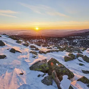 Outlook, sunset in winter on mount Lusen