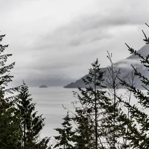 Overcast skies above a scenic view of a lake with islands Overcast skies above a scenic view of a lake with islands