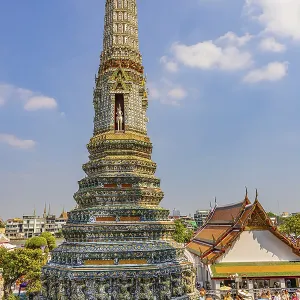 Pagoda with ceramic inlays surrounded by visitors and tourists Pagoda with ceramic inlays surrounded by visitors and tourists