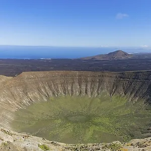 Panorama from the crater rim into the crater of Caldera Blanca Panorama from the crater rim into the crater of Caldera Blanca