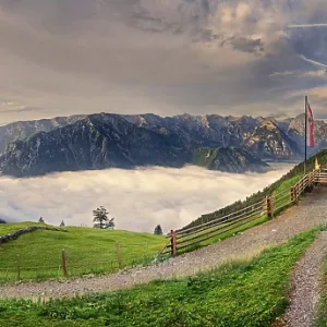 Panorama Dalfaz Alm at sunrise with fog in the valley above the Achensee Panorama Dalfaz Alm at sunrise with fog in the valley above the Achensee