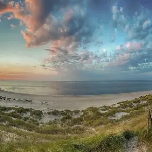 Panorama at the elbow with sunset and lighthouse Panorama at the elbow with sunset and lighthouse