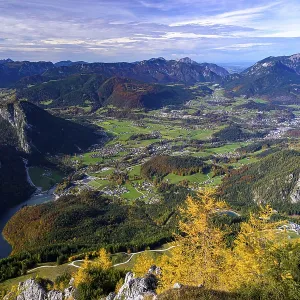 Panoramic view of a green valley with autumnal mountains Panoramic view of a green valley with autumnal mountains