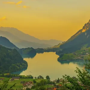 Panoramic View over Lake Lungern and Village with Mountain in Sunset in Lungern