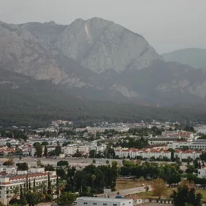 Panoramic view of mountains and coastline under an overcast sky Panoramic view of mountains and coastline under an overcast sky