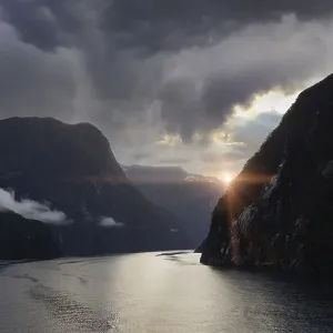 Panoramic view of scenic landscape of Milford Sound fjords in New Zealand at sunset Panoramic view of scenic landscape of Milford Sound fjords in New Zealand at sunset