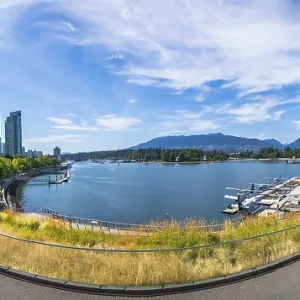 Panoramic view of vancouver's modern skyline rising above a picturesque waterfront
