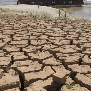 Parched, dry earth crust on the banks of the Mekong