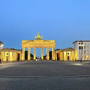 Pariser Platz with illuminated Brandenburg Gate at dawn
