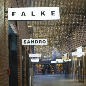 Passage with decorative fairy lights and shops such as Falke and Sandro Passage with decorative fairy lights and shops such as Falke and Sandro
