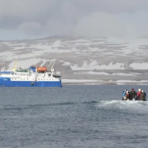 Passengers returning after being ashore in Zodiac inflatable boats to the expedition cruise ship Passengers returning after being ashore in Zodiac inflatable boats to the expedition cruise ship