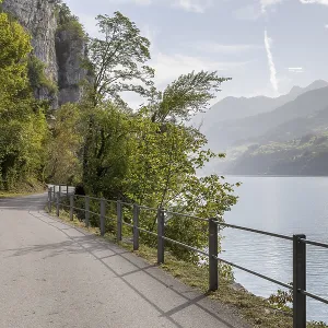 Path with a view along the steep rock faces on the northern shore of Lake Walen Path with a view along the steep rock faces on the northern shore of Lake Walen