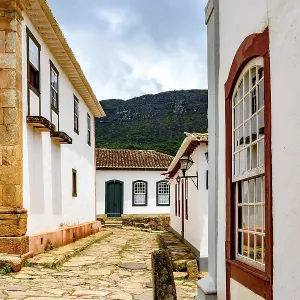 Paving stones made by slaves on the streets with colonial-style houses in the city of Tiradentes city Paving stones made by slaves on the streets with colonial-style houses in the city of Tiradentes city