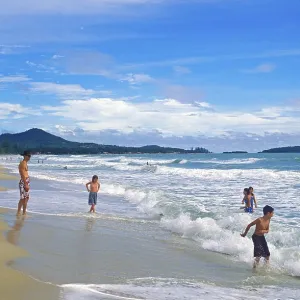 People, children, sea, surf, Chaweng Beach on Ko Samui People, children, sea, surf, Chaweng Beach on Ko Samui
