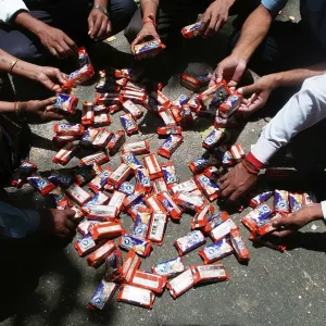 People sorting polluted biscuit packets due to container ship chitra colliding in sea Bombay Mumbai People sorting polluted biscuit packets due to container ship chitra colliding in sea Bombay Mumbai