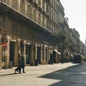 People and tram on an urban street