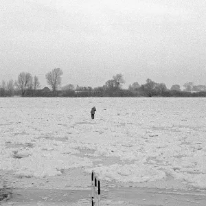 Person on ice rink, frozen Elbe